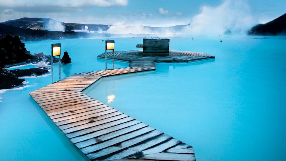 A chair sitting in front of a body of water