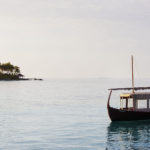 A small boat in a large body of water