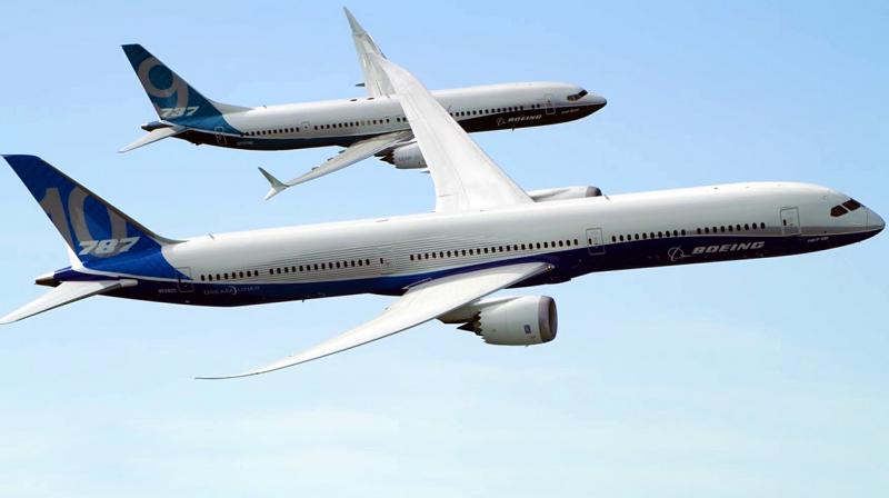 A large passenger jet flying through a blue sky