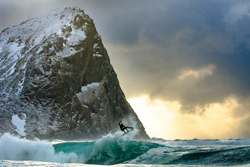 A man riding a wave on top of a mountain