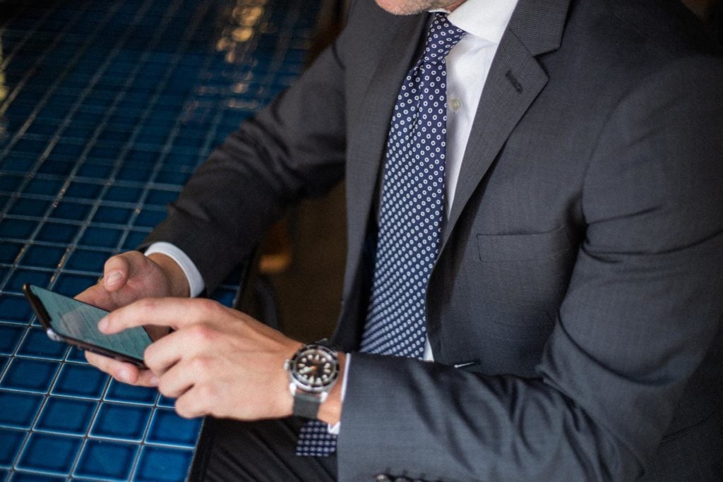 A man wearing a suit and tie