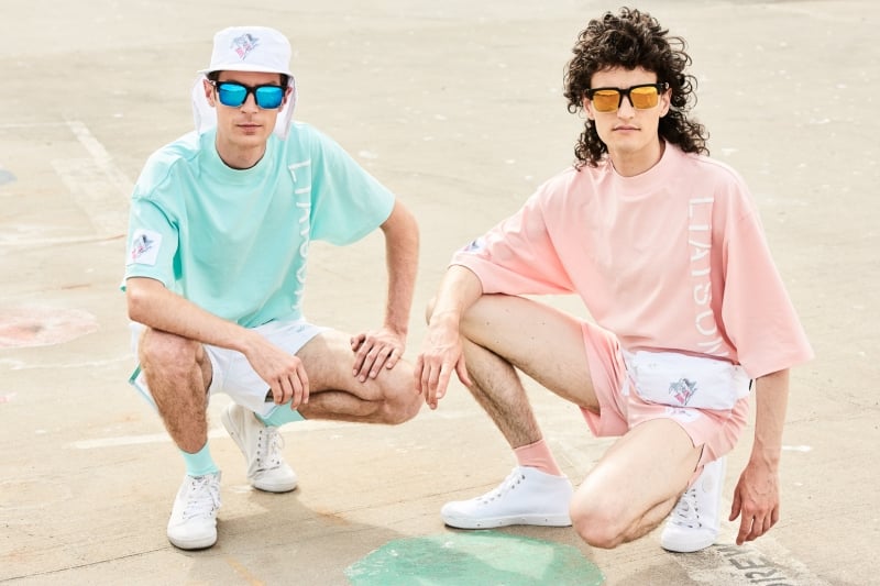 A group of people sitting at a beach