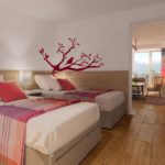 A bedroom with a large bed in a room