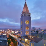 A large clock tower towering over a city