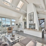 A living room filled with furniture and a large window