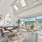 A living room filled with furniture and a large window