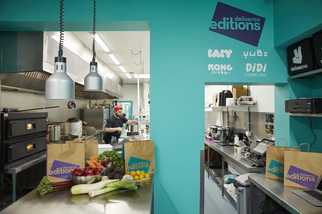 A kitchen that has a sign on a counter