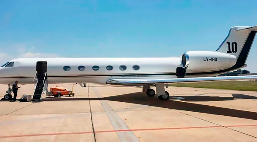 A large passenger jet sitting on top of a runway