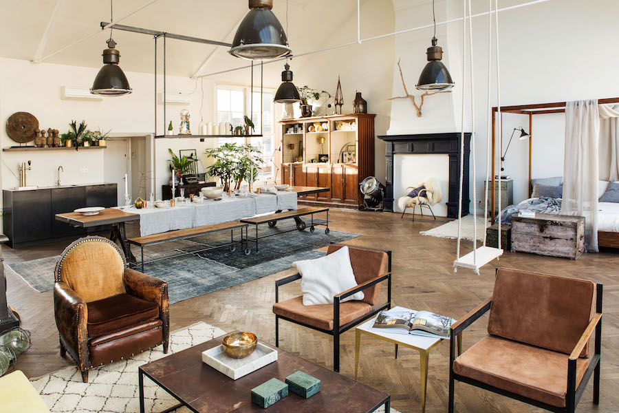 A living room filled with furniture and a fire place