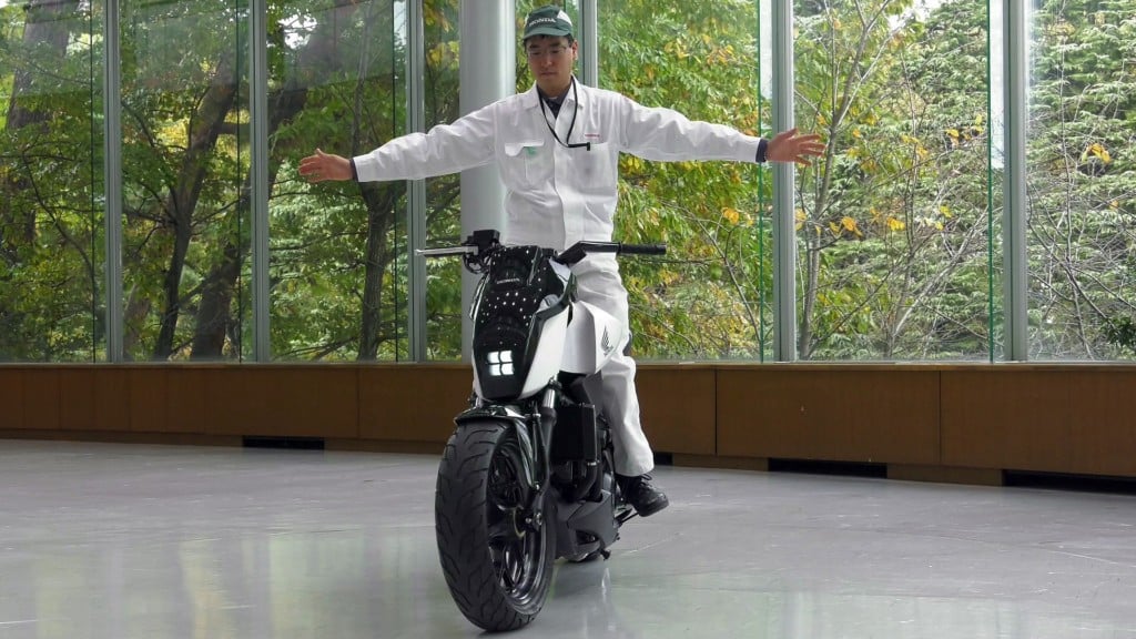 A man riding on the back of a motorcycle