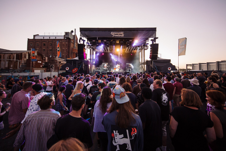 A group of people standing in front of a crowd