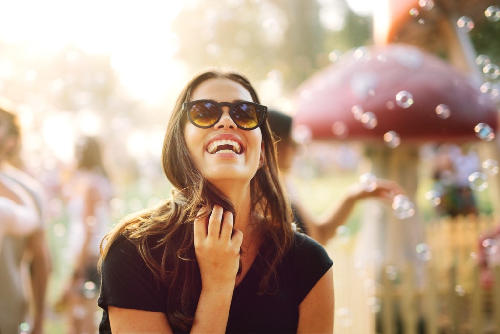 A woman wearing sunglasses posing for the camera