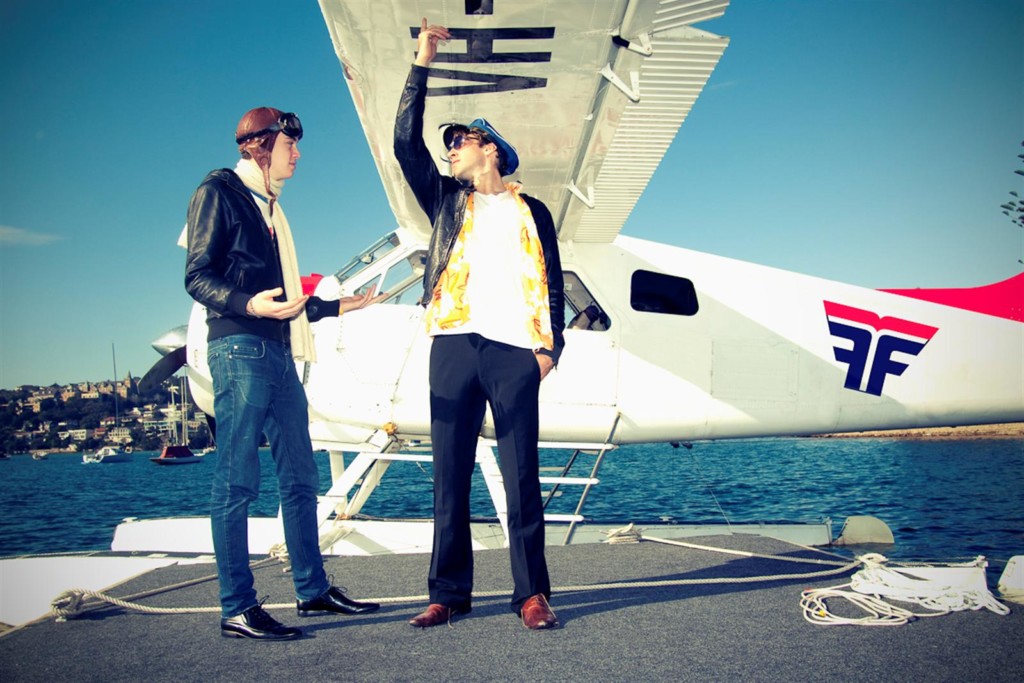 A group of people standing around a plane