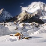 A man on a snow covered mountain