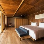 A bedroom with a large bed in a room