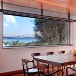 A dining room table in front of a window