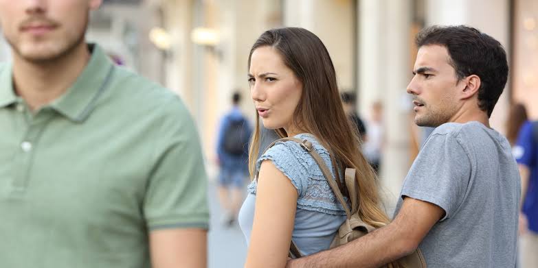 A man and a woman looking at the camera