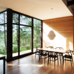 A dining room table in front of a window