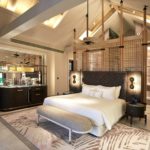 A bedroom with a large bed in a room