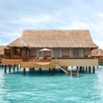 A wooden house in a pool of water