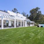 A large lawn in front of a house
