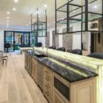 A large kitchen with stainless steel appliances and wooden cabinets