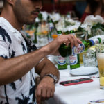 A man cutting food on a table