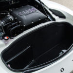 A close up of a piece of luggage sitting on top of a car