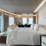 A bedroom with a large bed in a room