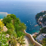 A close up of a hillside next to a body of water
