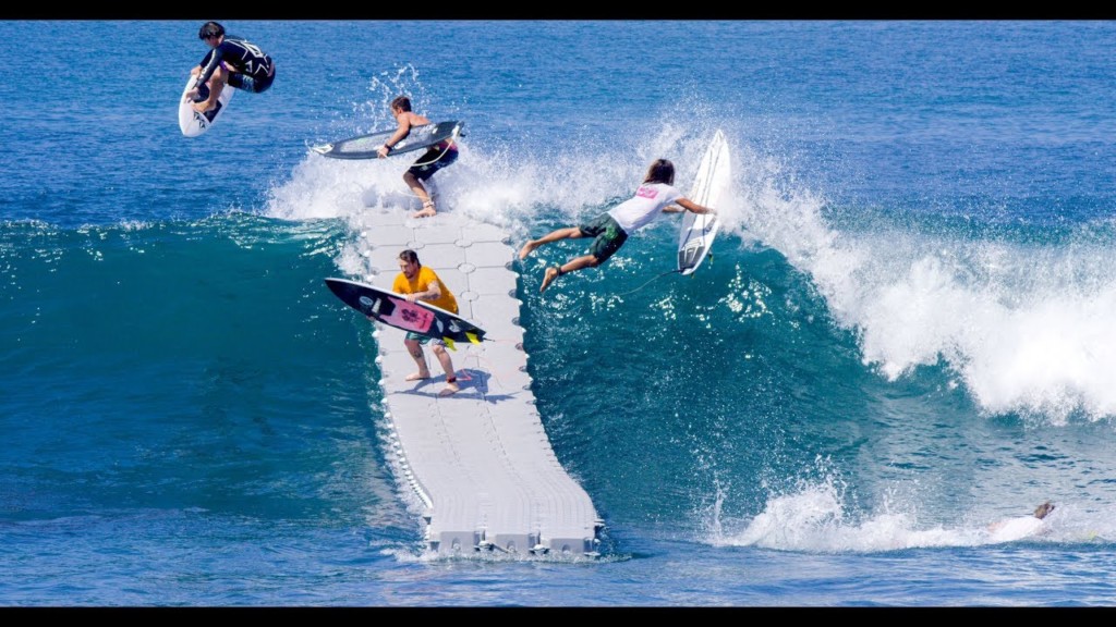 A man riding a wave on a surfboard in the water