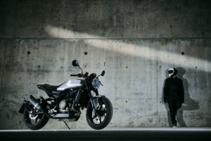 A motorcycle parked on the side of a building