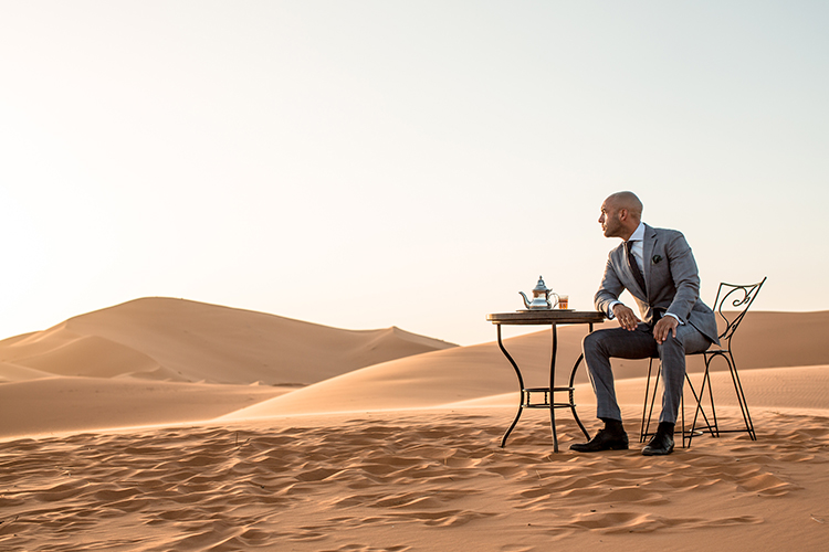 A man sitting at a beach