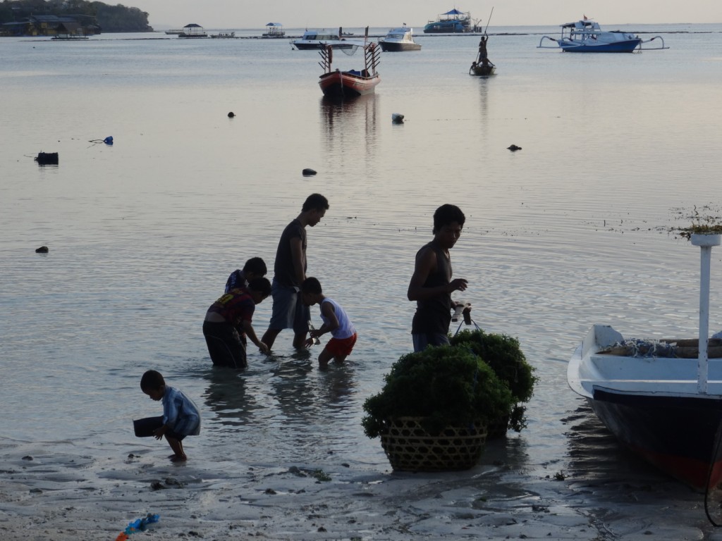 A group of people in a boat on a body of water