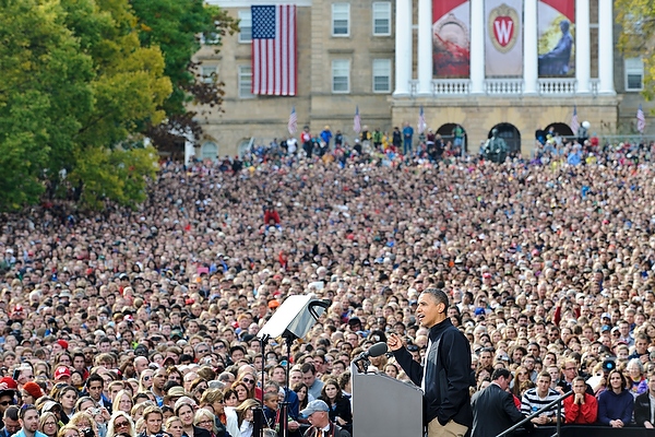 A group of people standing in front of a crowd