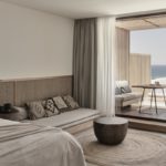 A bedroom with a large bed in a hotel room
