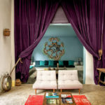 A living room filled with furniture and a curtain