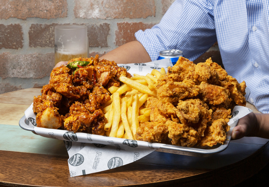 A person sitting at a table full of food