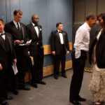 A group of people standing in a room
