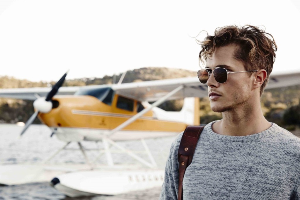 A person standing in front of a plane