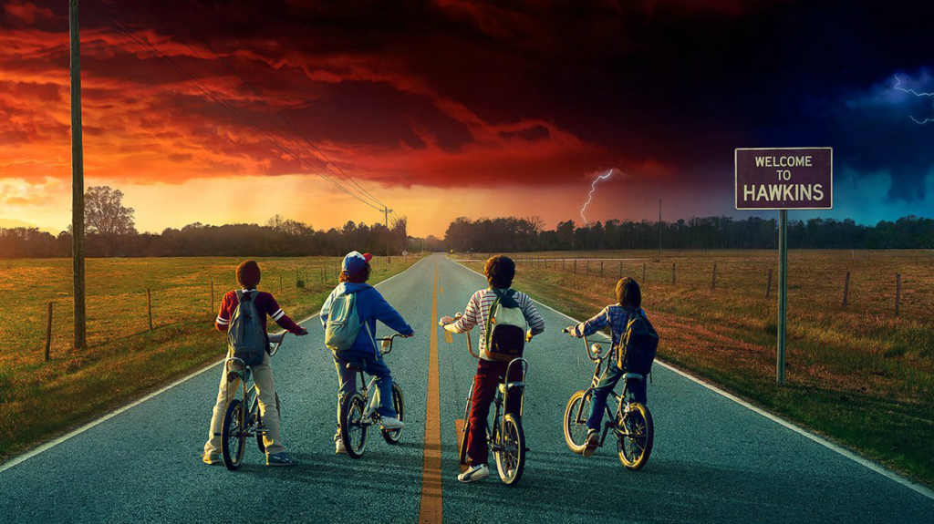 A group of people riding on the back of a bicycle