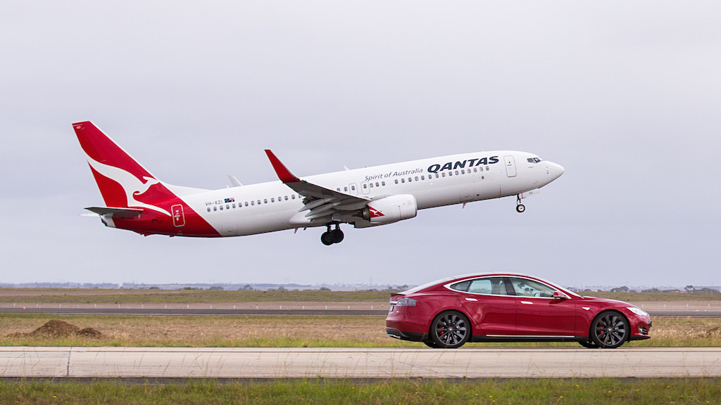 A airplane that is driving down the runway