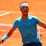 A man holding a racket on a court