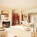 A living room filled with furniture and a sink
