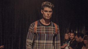 A man standing in a dark room