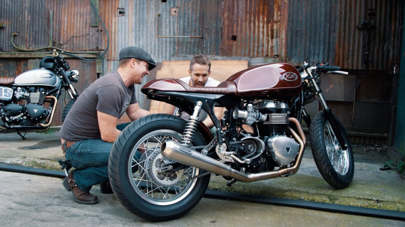 A motorcycle parked on the side of a building