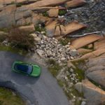 A close up of a stone building that has a rocky cliff