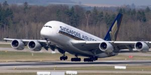 A large passenger jet sitting on top of a runway