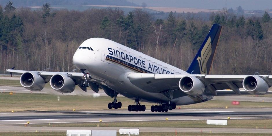 A large passenger jet sitting on top of a runway