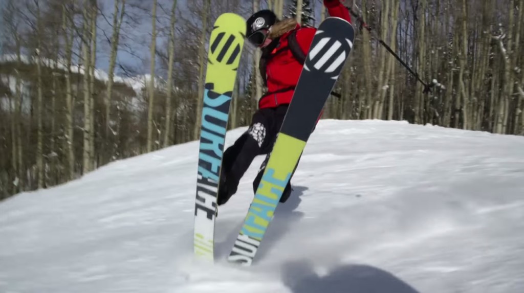 A person riding a snow board in the air